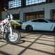 The Red Shift SM parked next to CCC’s new Ford Shelby Mustang GT350.